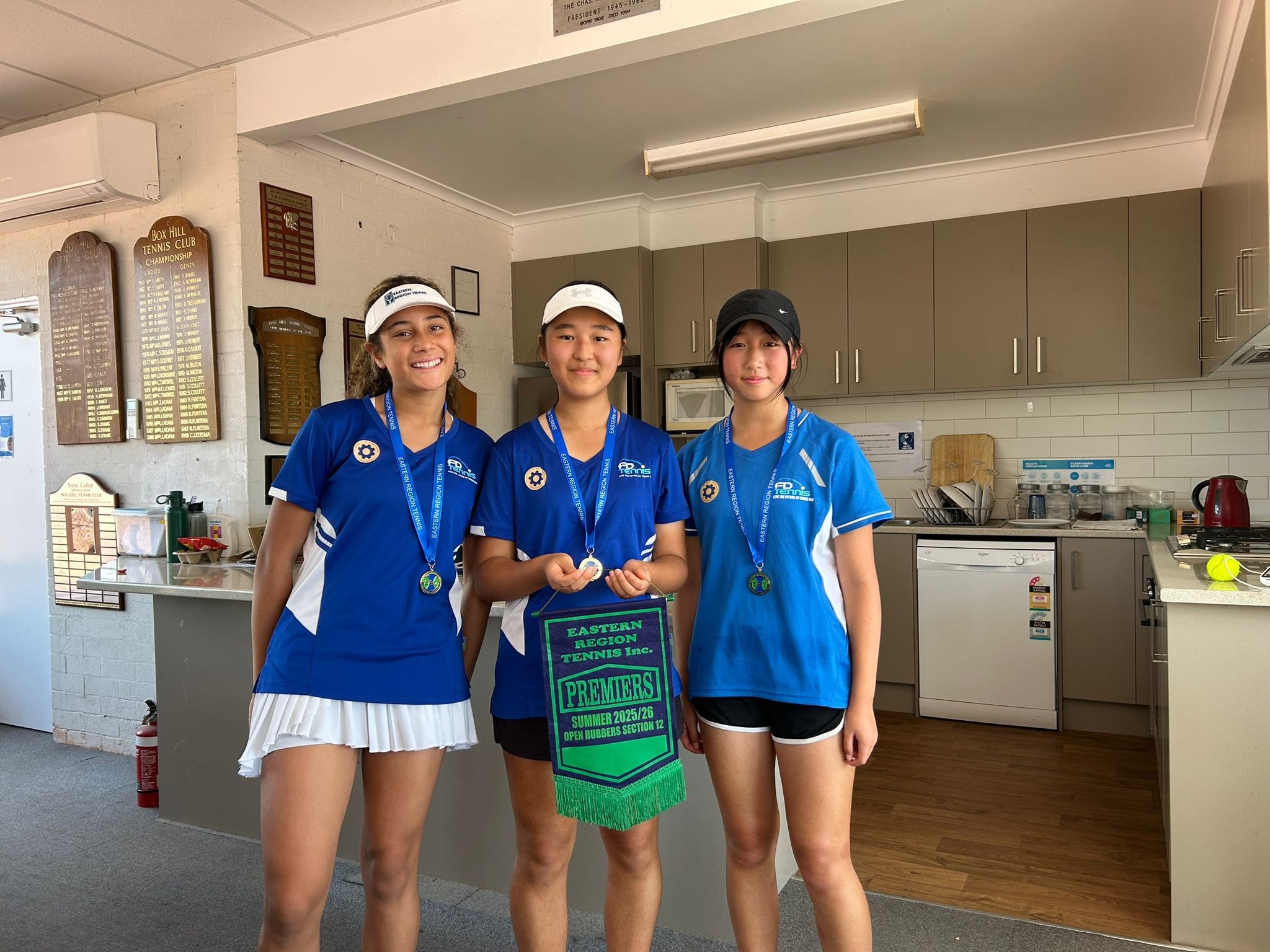 Our girls team with their junior pennant
